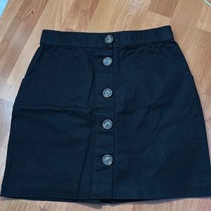 black skirt with buttons